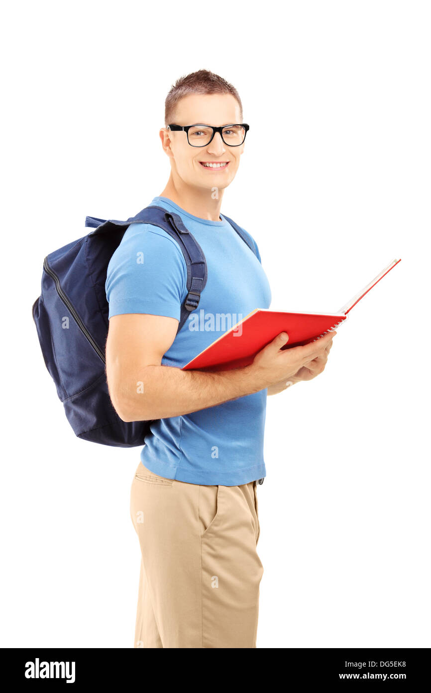 Smiling male student with backpack reading a book Stock Photo - Alamy