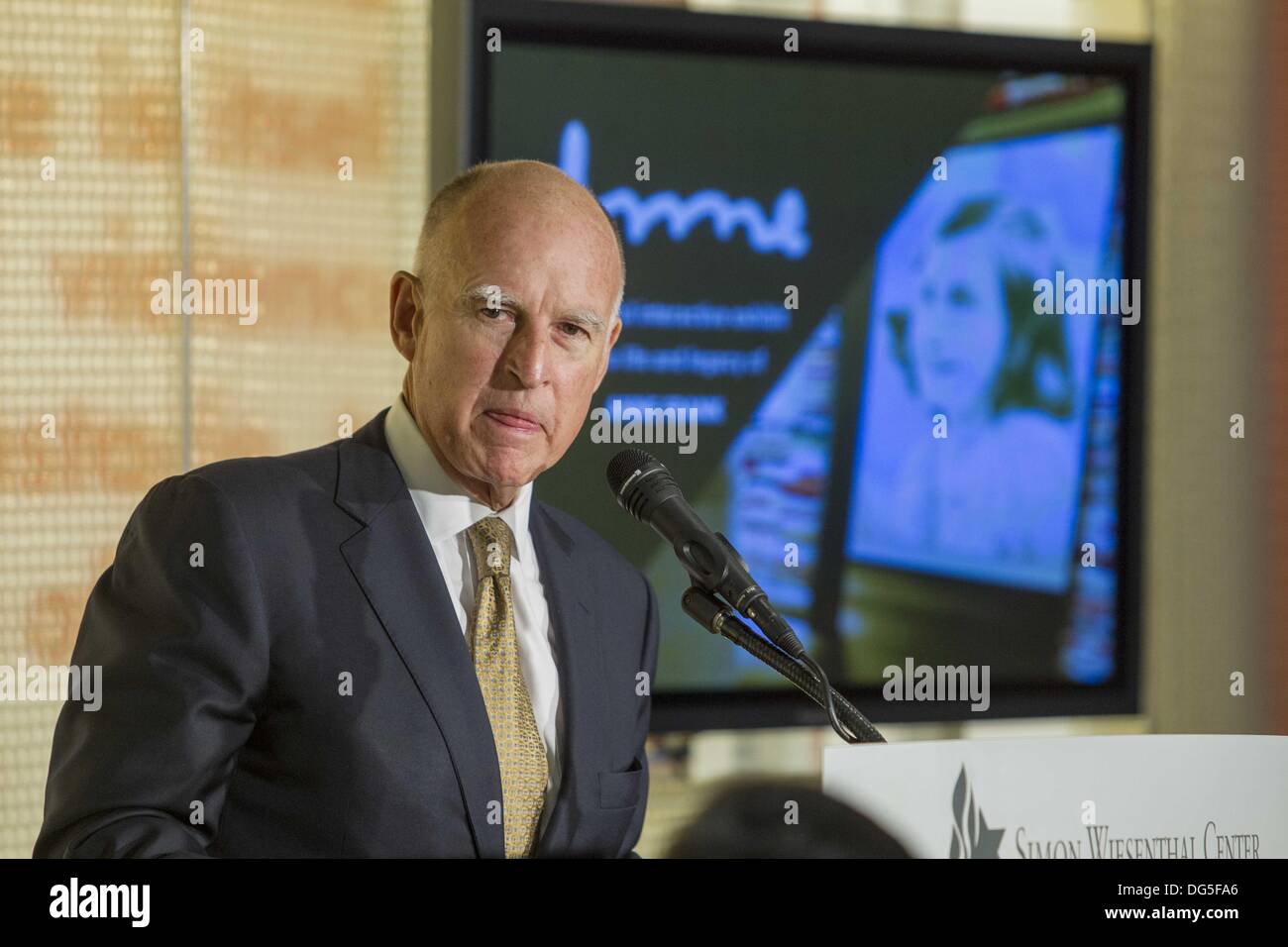 Los Angeles, California, USA. 14th Oct, 2013. California Governor Jerry Brown delivers a keynote at the Museum of Tolerance's opening of ''Anne'' exhibition on Monday October 14, 2013 in Los Angeles. ''Anne'' a 60-minute experience created by the Simon Wiesenthal Center and narrated by actress Hailee Steinfeld that brings to life the story of Anne Frank through multimedia presentations displays. © Ringo Chiu/ZUMAPRESS.com/Alamy Live News Stock Photo