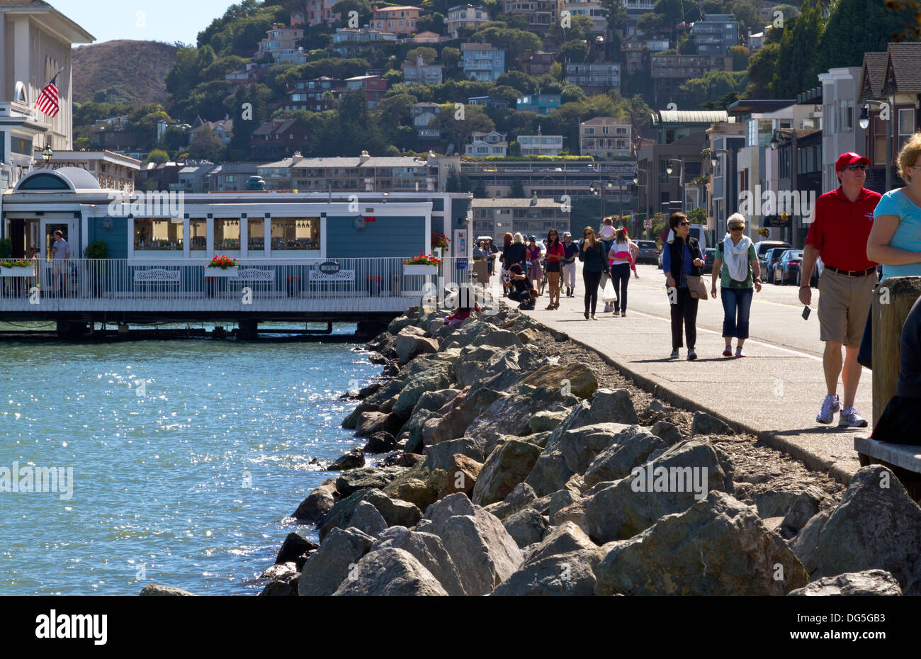 Tourists strolling along Bridgeway Street in Sausalito, California with