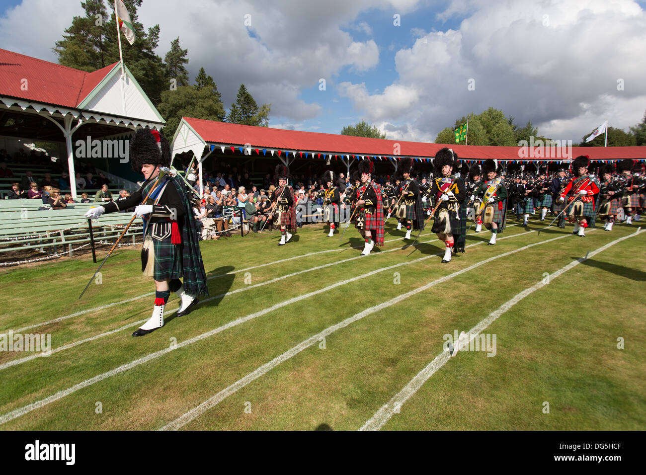 Village of Braemar, Scotland. The massed pipe bands marching at the Royal Braemar Gathering games. Stock Photo