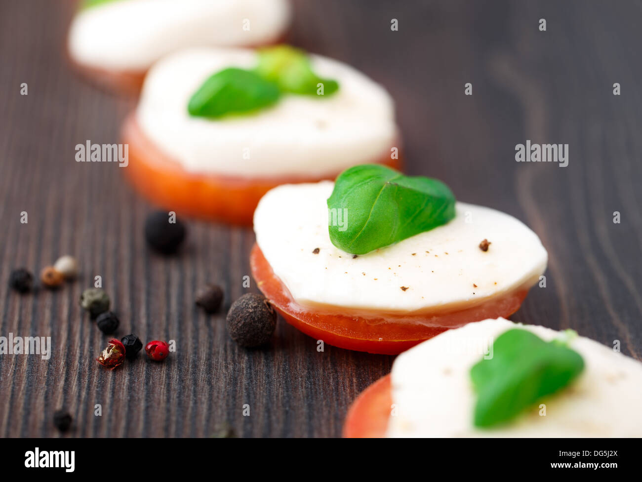 Tomato and mozzarella with basil leaves Stock Photo - Alamy