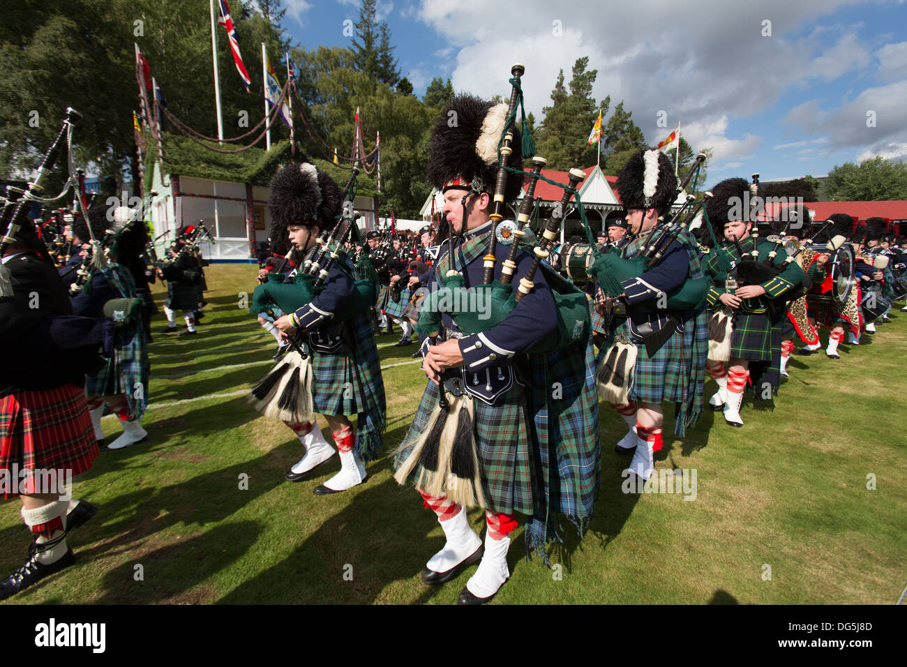 Village of Braemar, Scotland. The massed pipe bands marching at the Royal Braemar Gathering games. Stock Photo