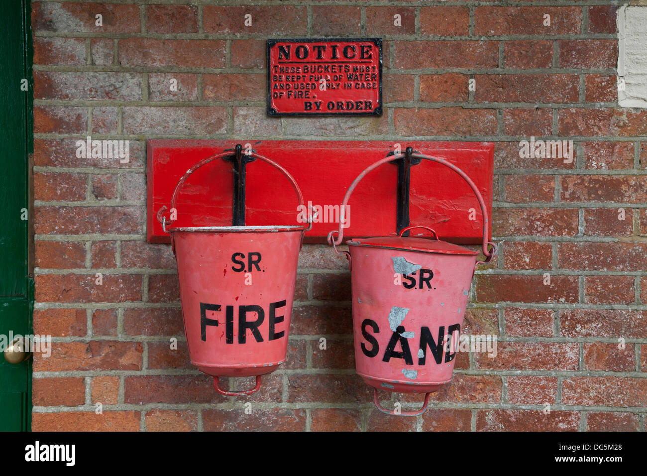 Fire buckets at Horsted Keynes train station on the vintage Bluebell railway line. Stock Photo