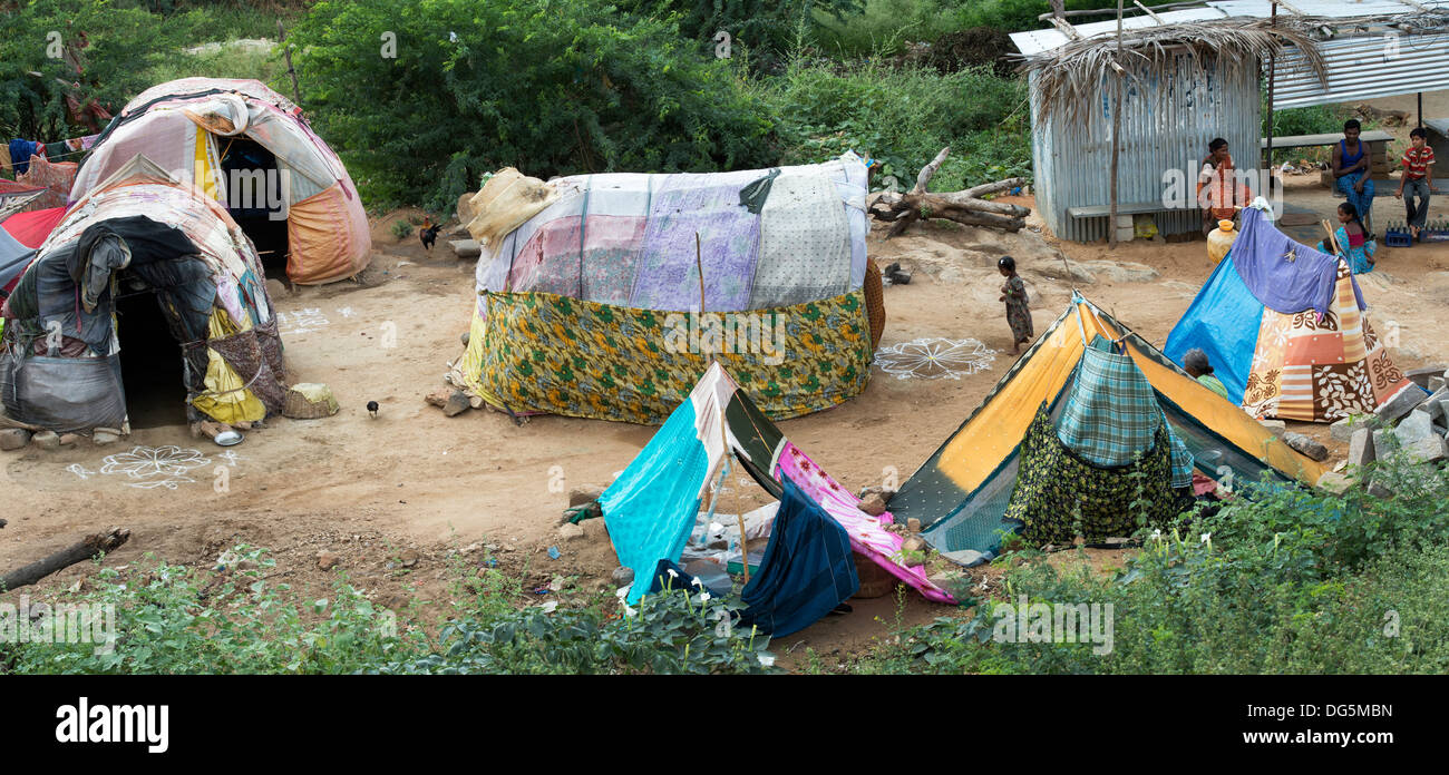 Lower caste Indian people outside their benders / tents / shelters. Andhra Pradesh, India. Panoramic Stock Photo