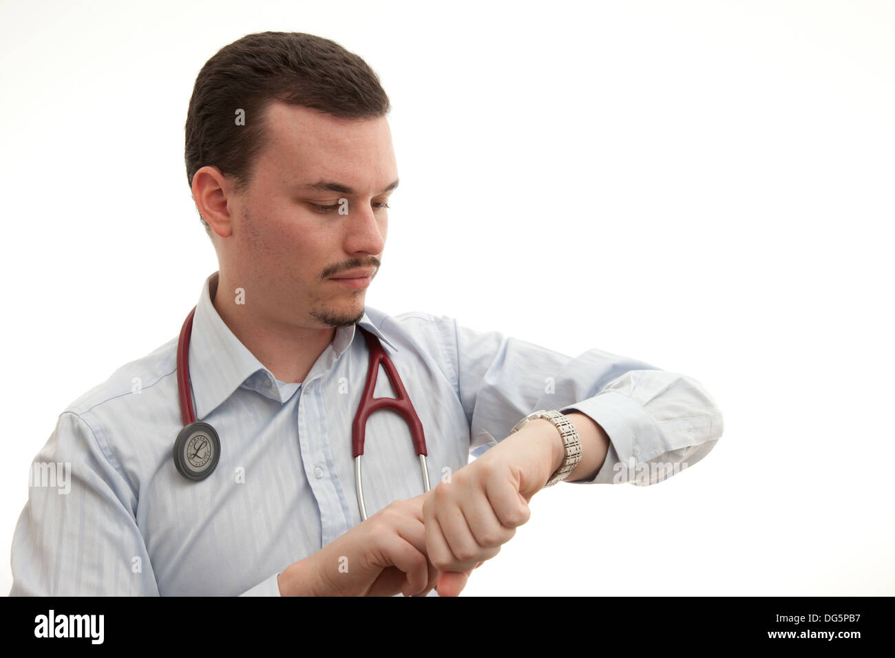 Portrait Of Male Doctor Checking Time On White Background Stock Photo ...