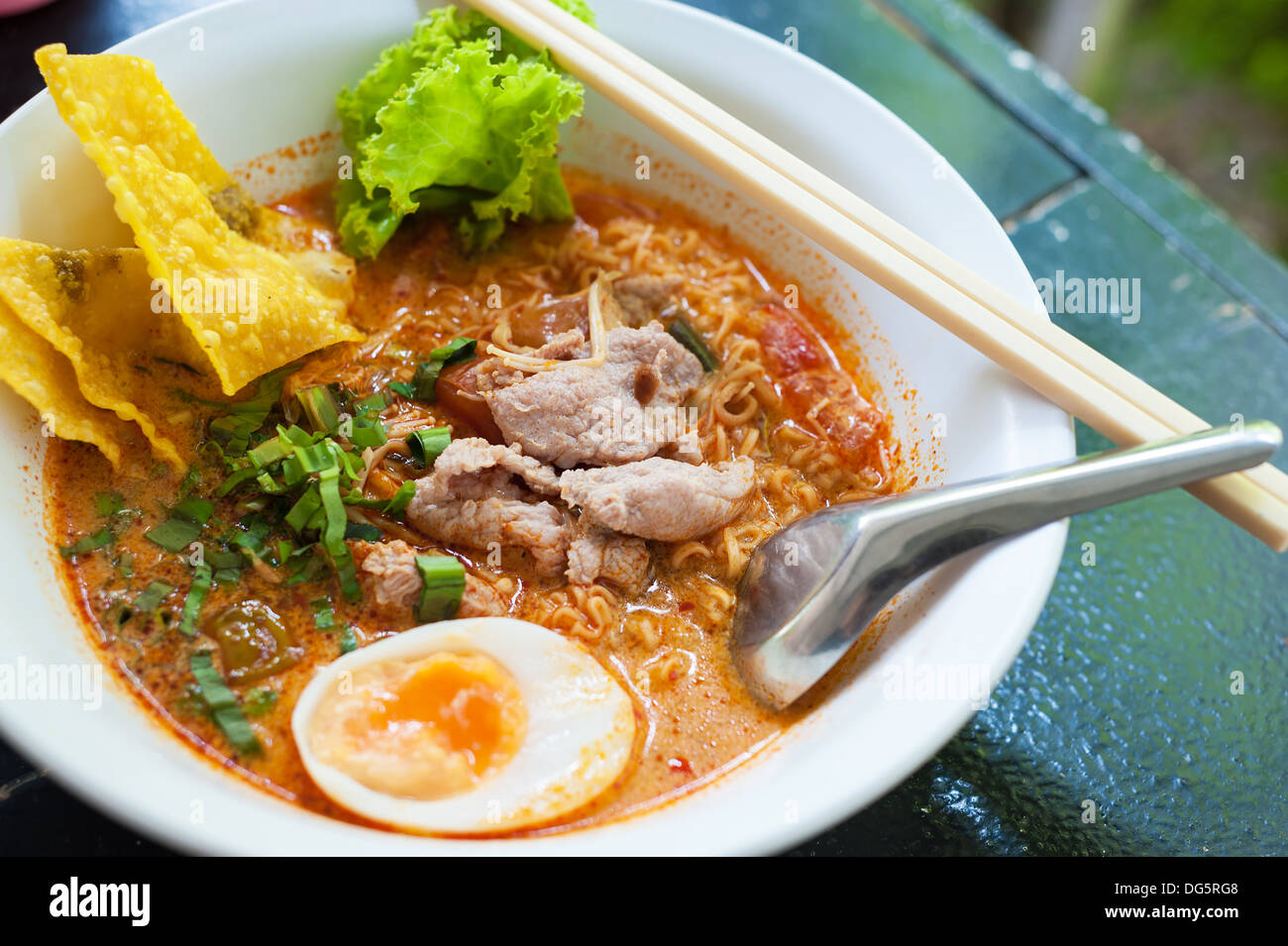 Pork noodle tom yum, condensed water egg. Stock Photo