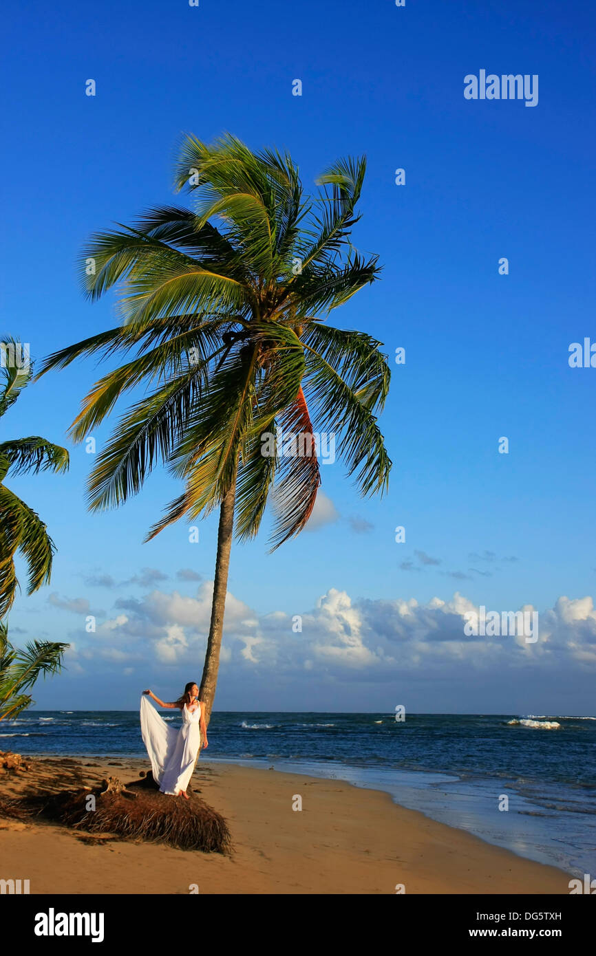 Young woman in white dress on a beach Stock Photo - Alamy