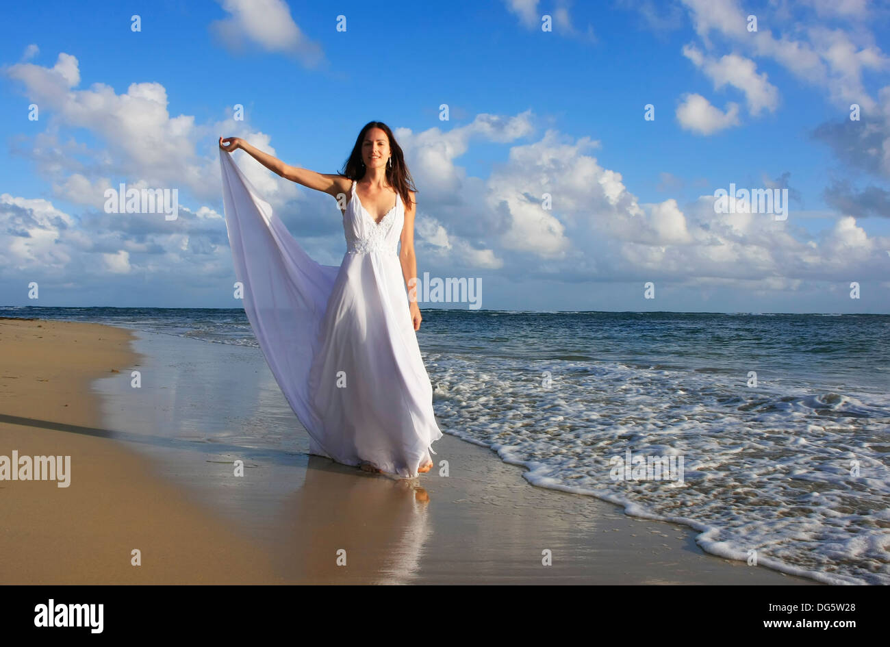 Woman walking white dress hi-res stock photography and images - Alamy