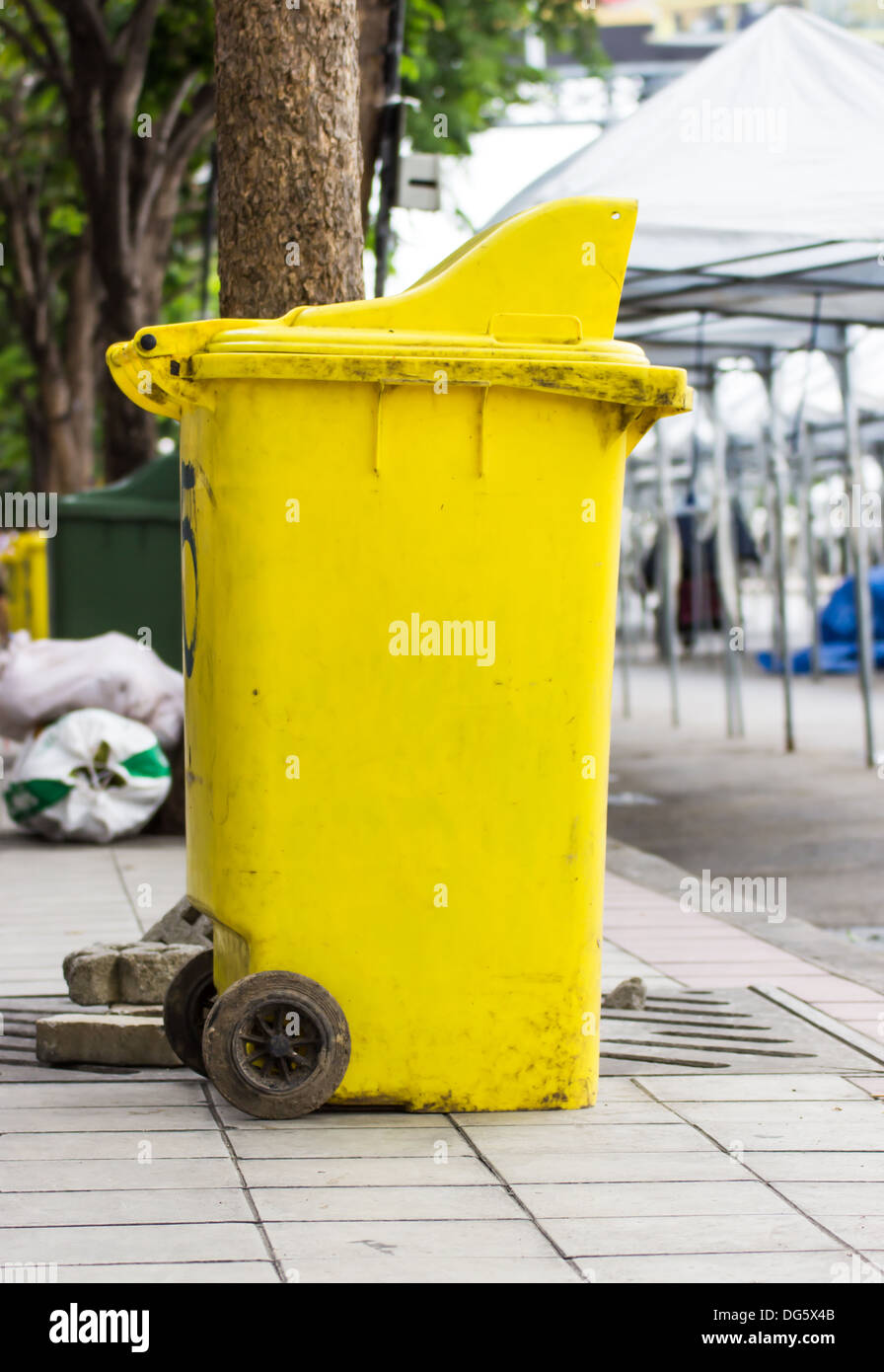 Yellow rubbish bin Stock Photo Alamy