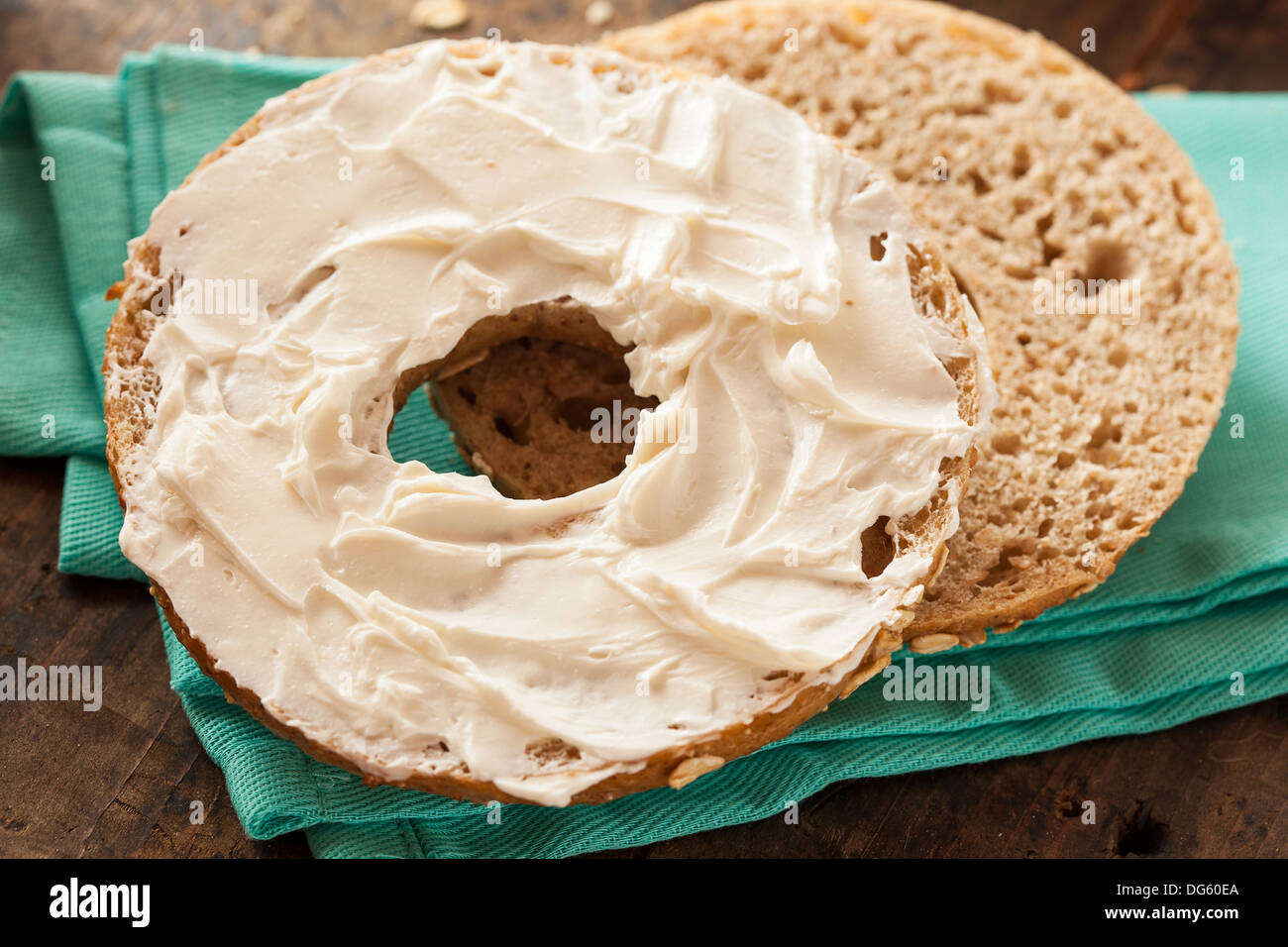 Healthy Organic Whole Grain Bagel with Cream Cheese Stock Photo