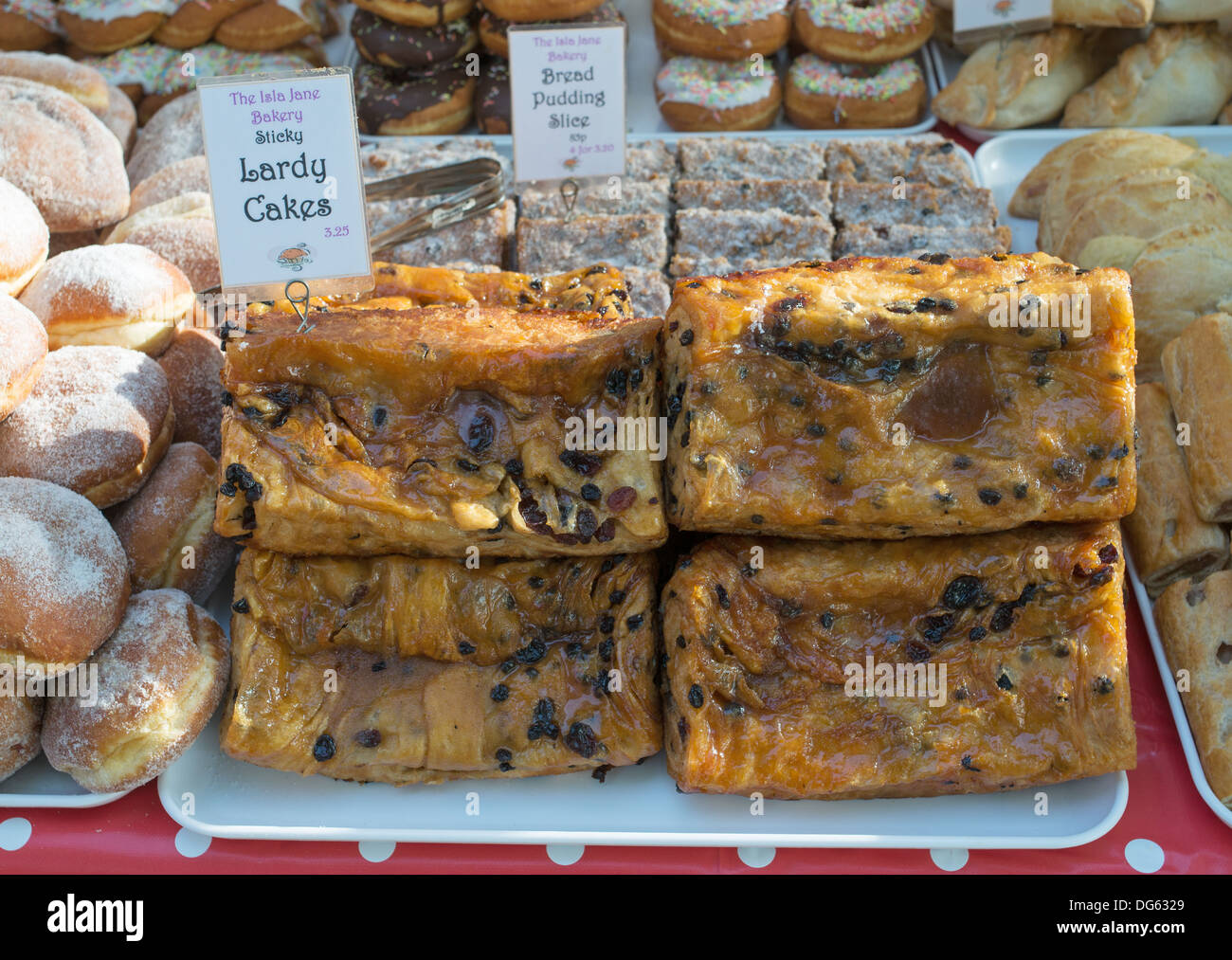 Lardy cakes for sale within Aylesbury outdoor market, England, UK Stock Photo