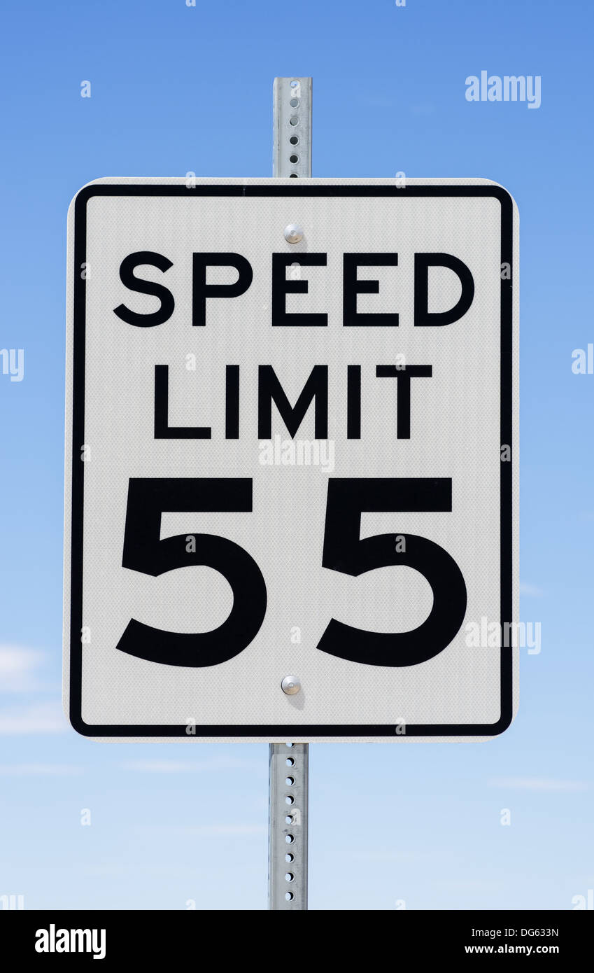 speed limit 55 sign with blue sky background Stock Photo - Alamy