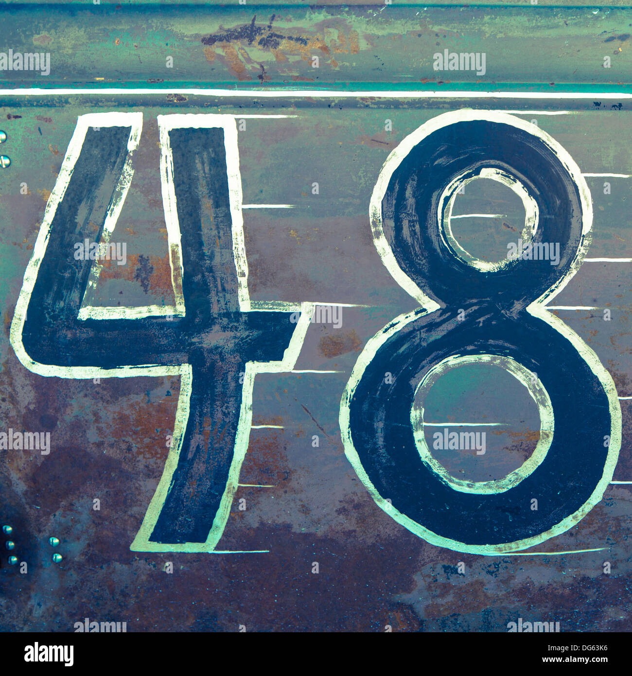 Old gates with painted 48 numeric numbers. Stock Photo