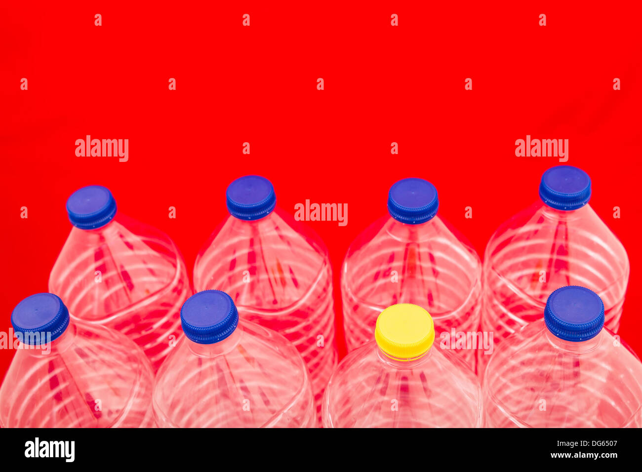 Empty bottles of mineral water, one with a different lid Stock Photo Alamy