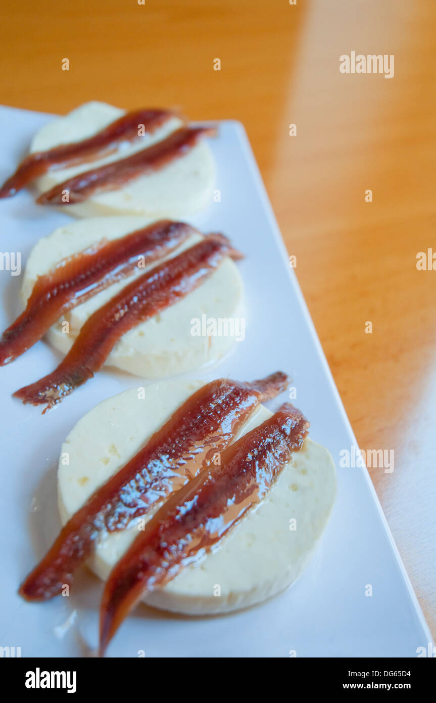 Typical Spanish Tapas Made Of Cottage Cheese And Anchovy Fillets