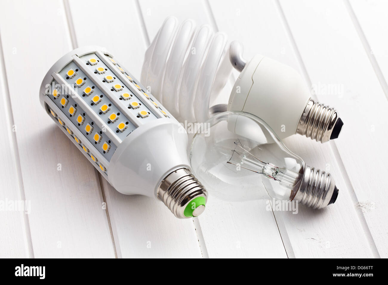 various lighting bulbs on wooden background Stock Photo