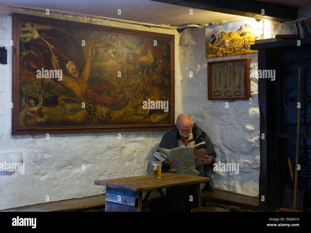 Elderly man sitting in the climber's bar of the Old Dungeon Ghyll Hotel