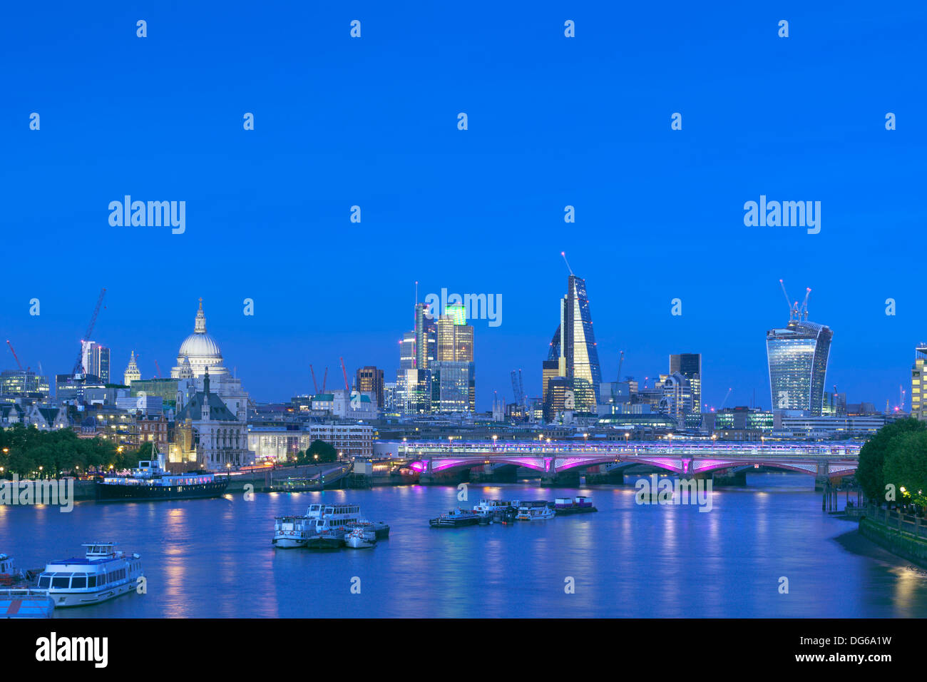 London skyline and river Thames at dusk, London, England Stock Photo