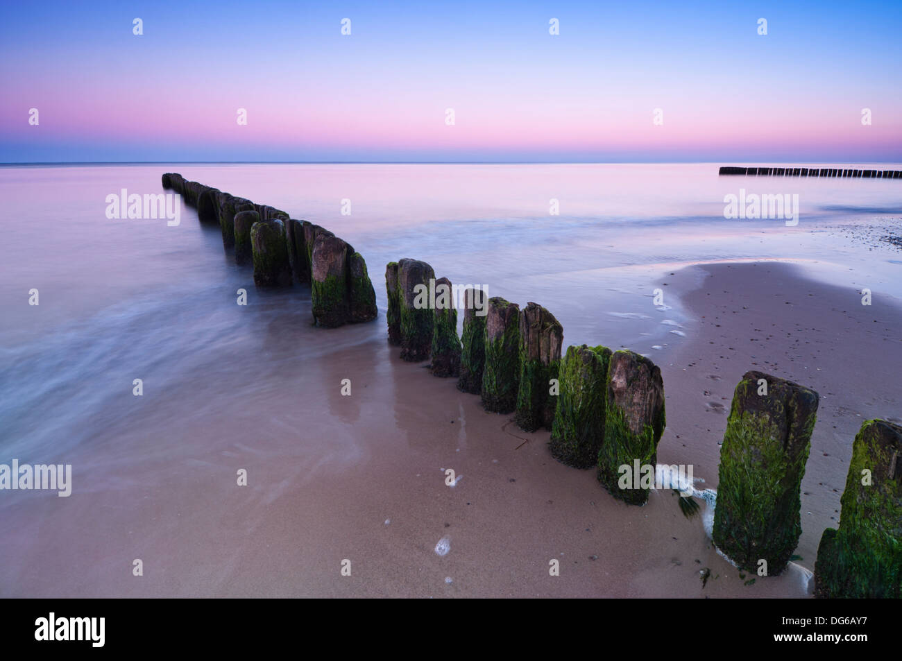Long exposure shot over breakwater on Baltic Sea shoreline. Stock Photo