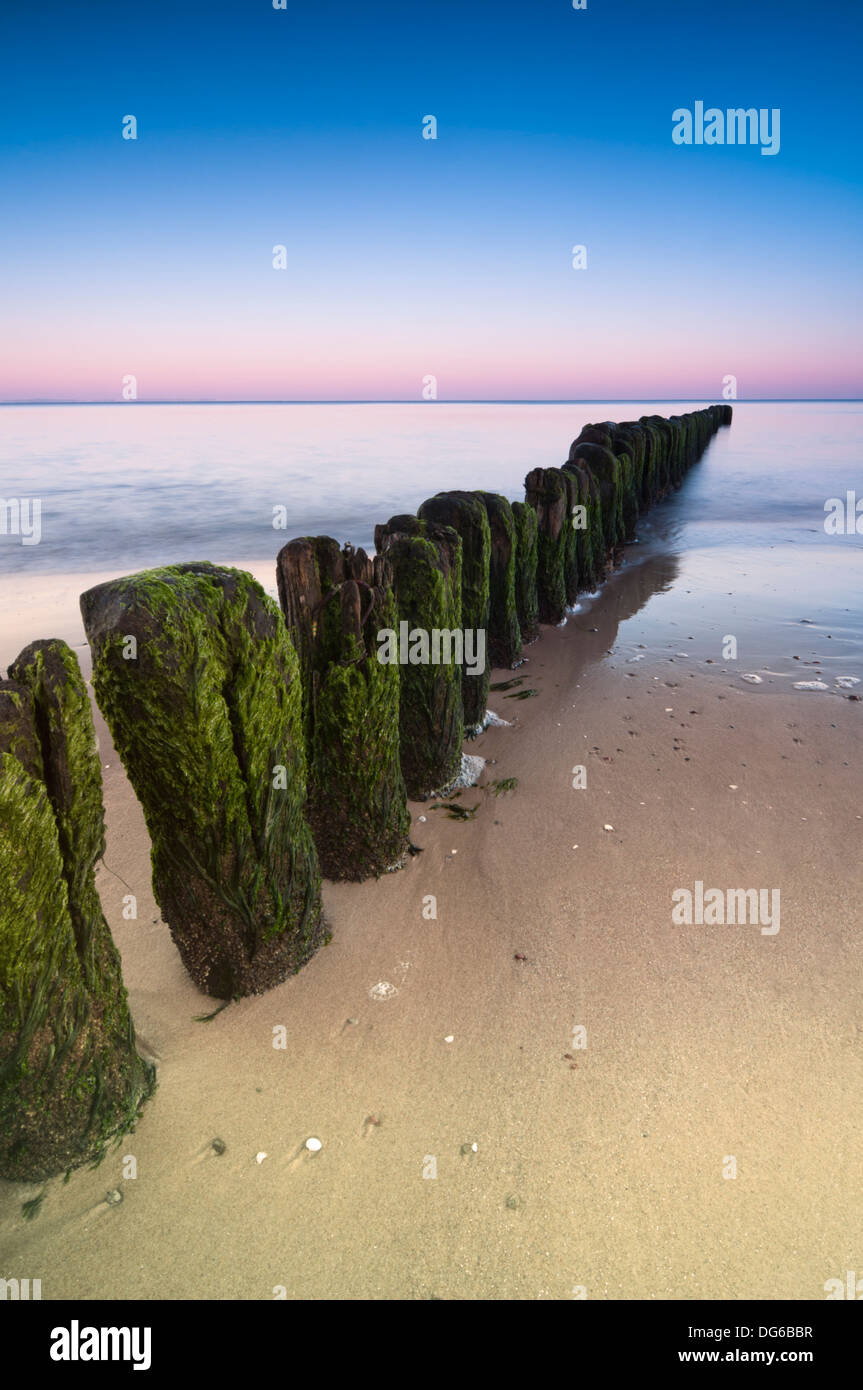 Long exposure shot over breakwater on Baltic Sea shoreline. Stock Photo