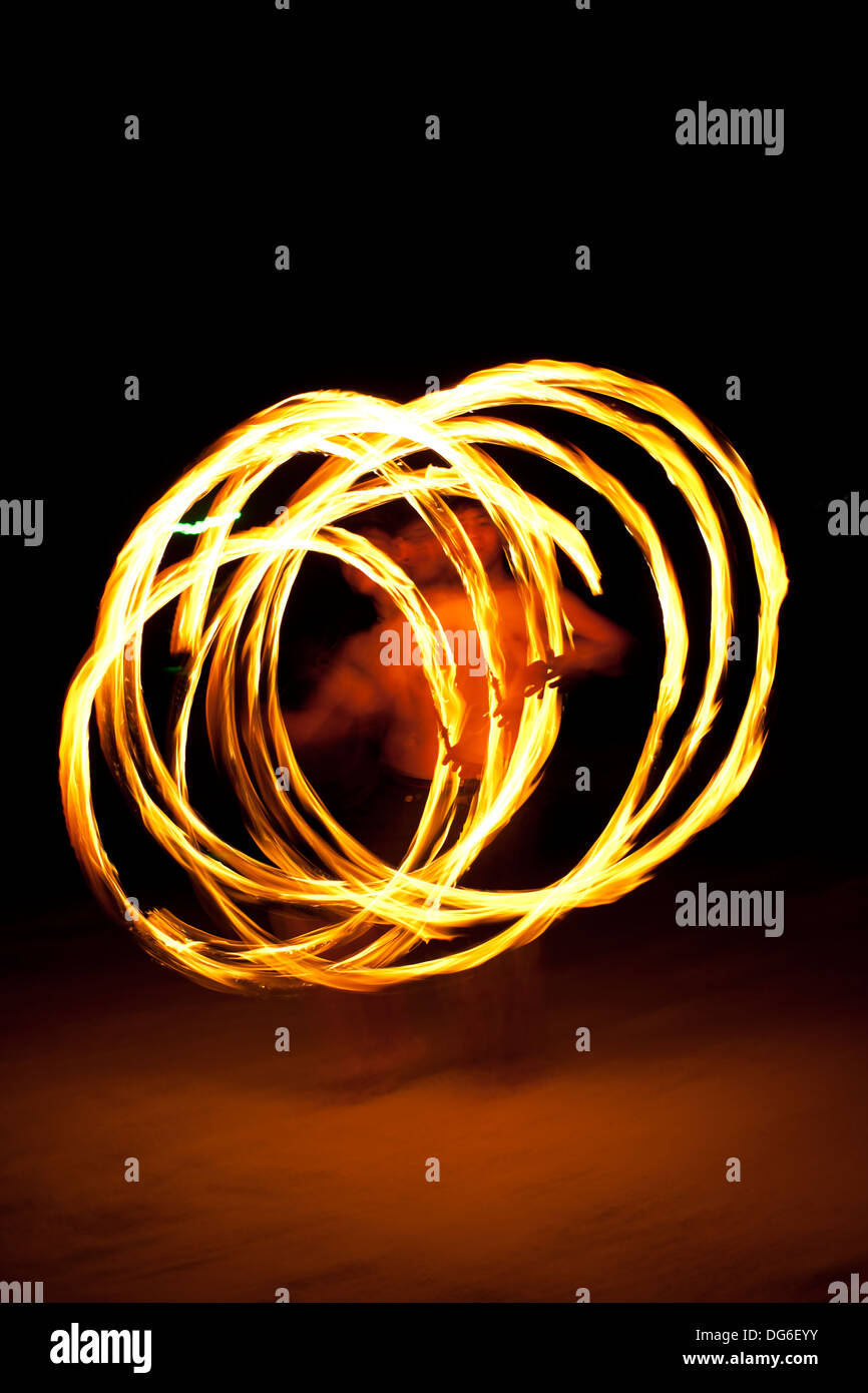 fire dance, male performance fire twirling dance on the island Stock