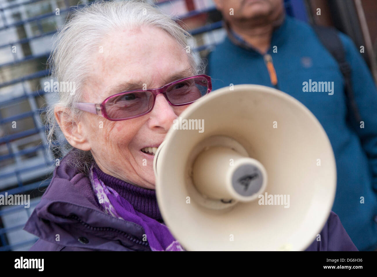 London, UK. 15th October 2013. An anti-racism campaigner demonstrates outside National Estate Agents in Willesden Green, North London, against lettings agents found to have denied rental properties to Afro-Caribbean homeseekers. Credit:  Paul Davey/Alamy Live News Stock Photo