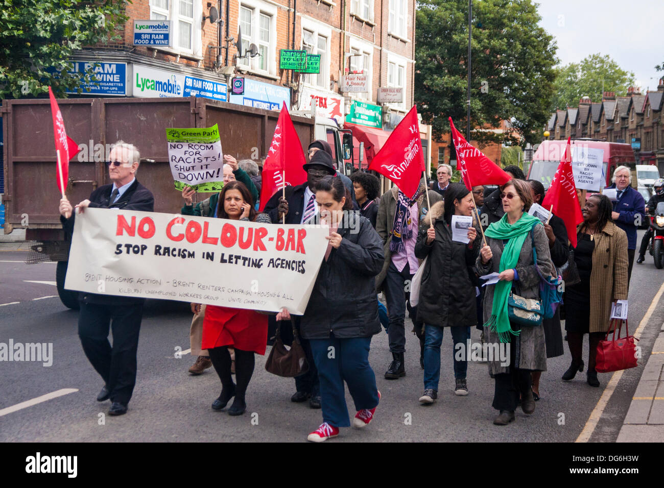 London, UK. 15th October 2013. Anti-racism campaigners march along the High Street in Willesden Green, North London, against lettings agents found to have denied rental properties to Afro-Caribbean homeseekers. Credit:  Paul Davey/Alamy Live News Stock Photo