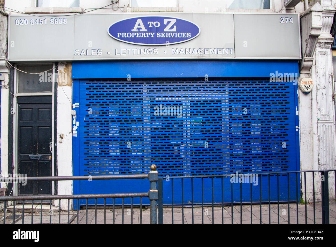 London, UK. 15th October 2013. Shop closed as Anti-racism campaigners demonstrate outside A to Z Property Services in Willesden Green, North London,  caught out denying rental properties to Afro-Caribbean homeseekers. Credit:  Paul Davey/Alamy Live News Stock Photo