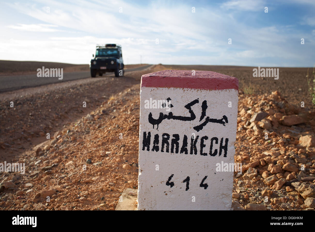 Milestone along the 'Erg Chigaga' desert road, leading to Marrakesh. Western Sahara desert, Morocco. Stock Photo