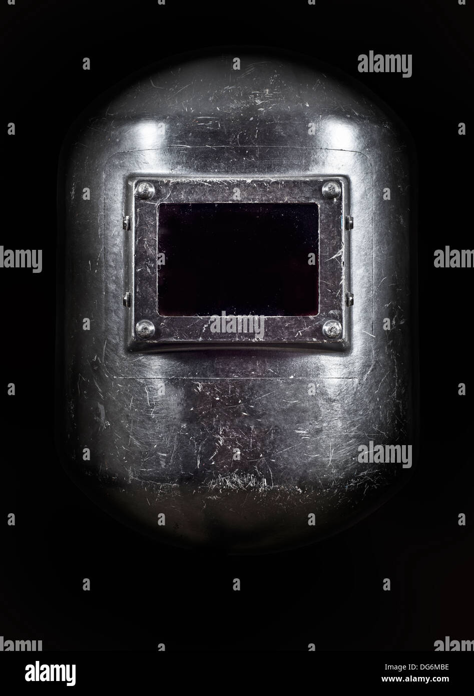 A welders Helmet front view, low key lighting. Stock Photo