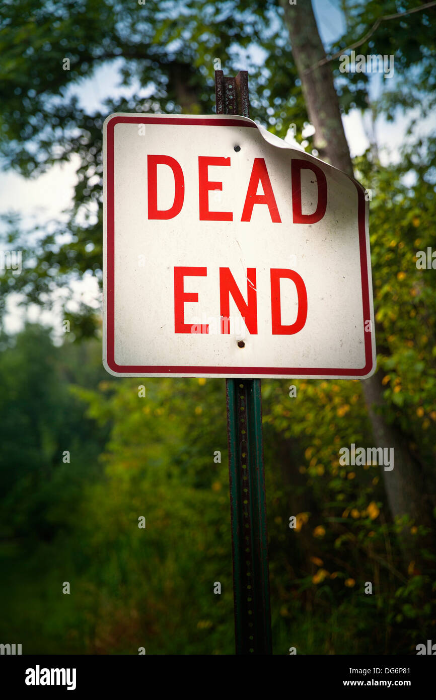 Bold red dead end sign marks the end of the road Stock Photo