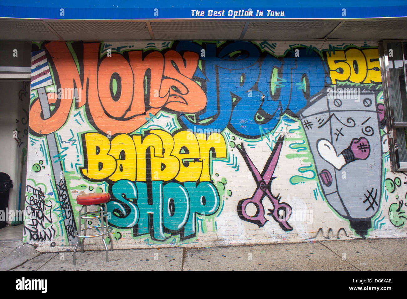 Mural advertises barber shop in the Melrose neighborhood of the Bronx in New York Stock Photo