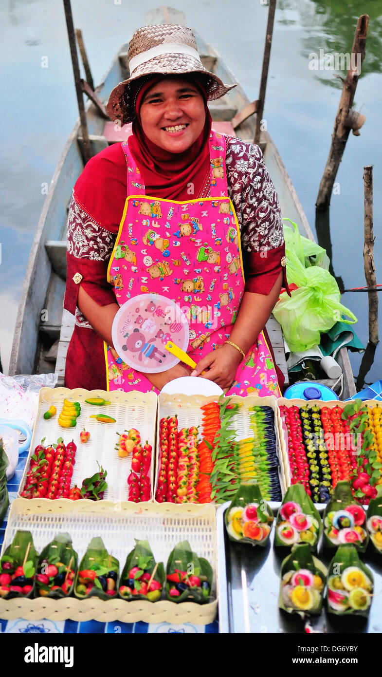 Boat vendor at the Hatyai's Klong Hae Floating Market in Southern Thailand Stock Photo