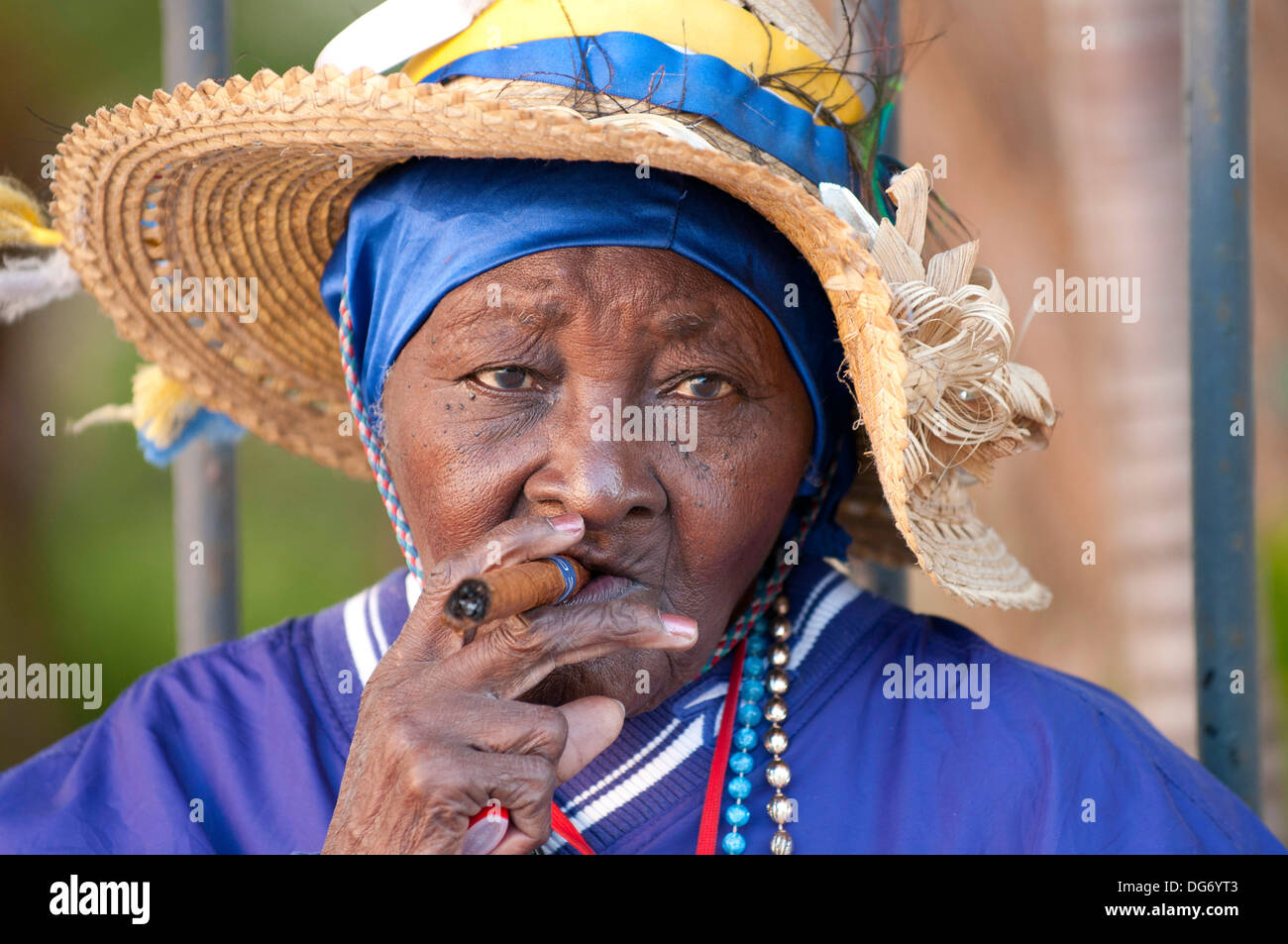 Elderly Afro Cuban, Hispanic woman smoking Havana cigar, in Cuba Stock Photo
