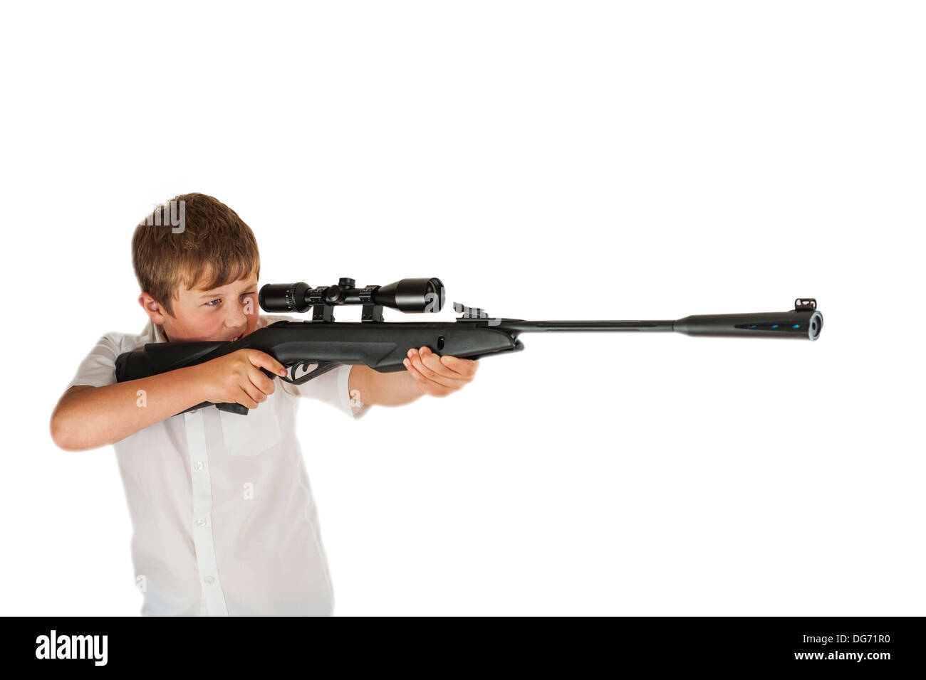 A boy of 10 with his air rifle with telescopic sights Stock Photo