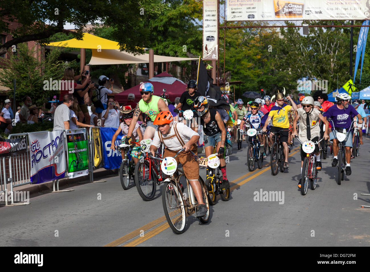 Cyclists in fancy dress taking part in the annual Charity cycle race, Grand Junction, Colorado, USA Stock Photo