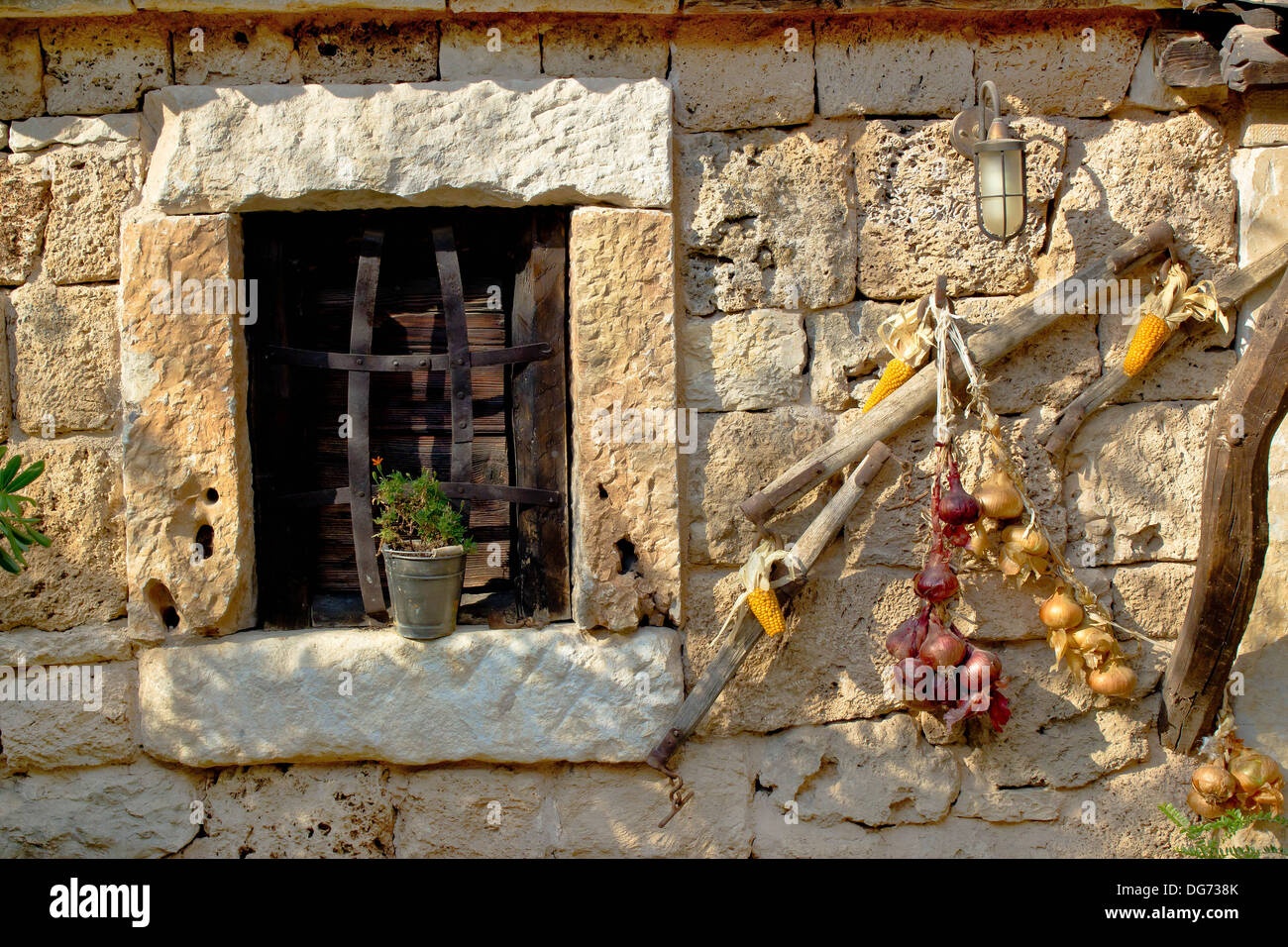 Traditional dalmatian stone house window with ornaments, Dalmatia