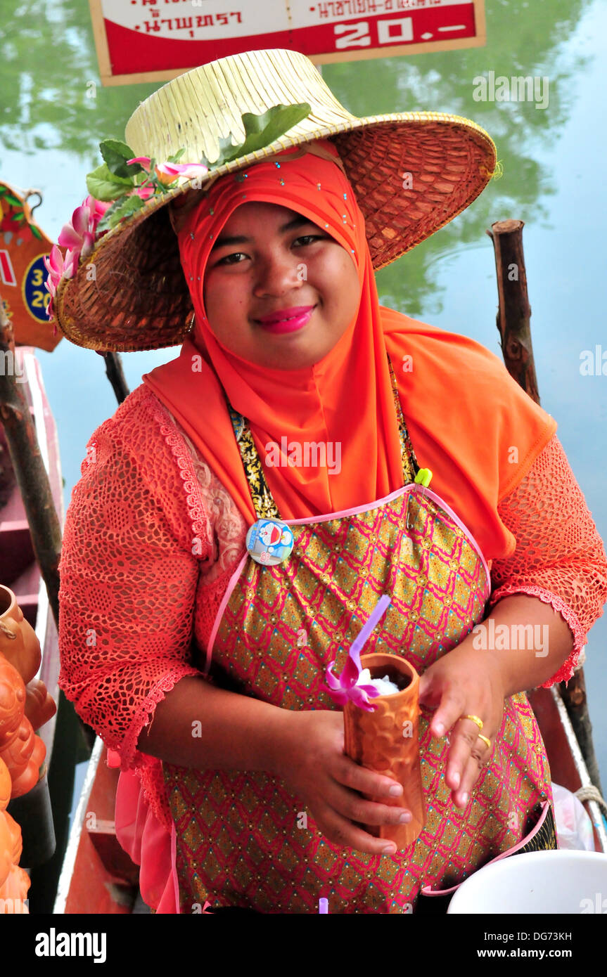 A Thai Muslim drink seller Hatyai's Klong Hae Floating Market in Southern Thailand Stock Photo