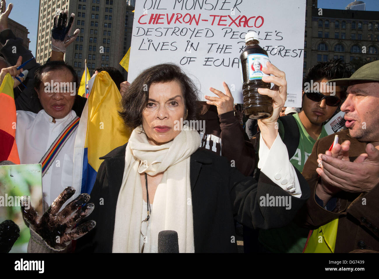 New York, USA. 15th October 2013. Bianca Jagger speaks out against Chevron.Ecuadorean protesters some wearing traditional dress demonstrated outside the United States courthouse near Foley Square in lower Manhattan. A court in Ecuador has made a judgment against Chevron for $18 billion. Chevron lawyers today in this courthouse are trying to  persuade a judge that Ecuadorean's have used bribery to win the settlement. Credit:  Scott Houston/Alamy Live News Stock Photo