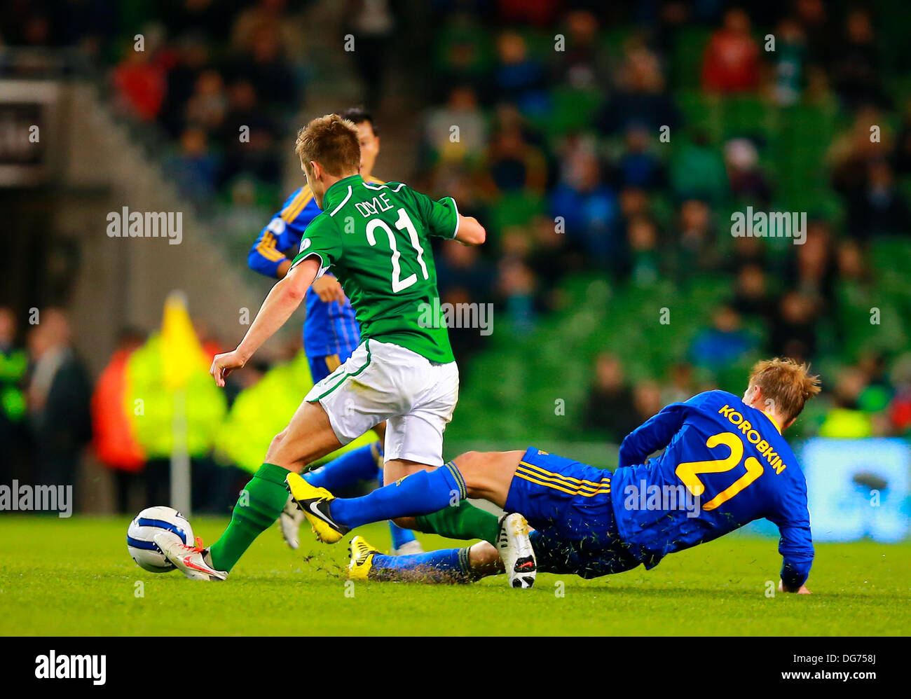 Dublin, Ireland. 15th Oct, 2013. Valeriy Korobkin (Kazakhstan) slides in  with a two footed challenge on Kevin Doyle (Rep of Ireland) during the  World Cup Qualifier between Republic of Ireland and Kazakhstan