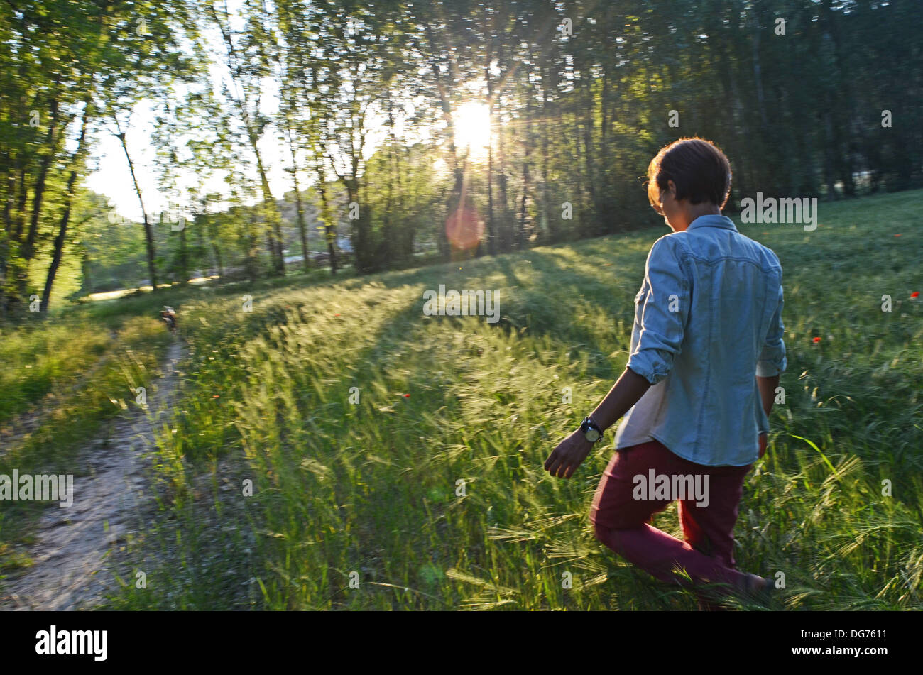 Young attractive woman takes a walk in nature Stock Photo - Alamy