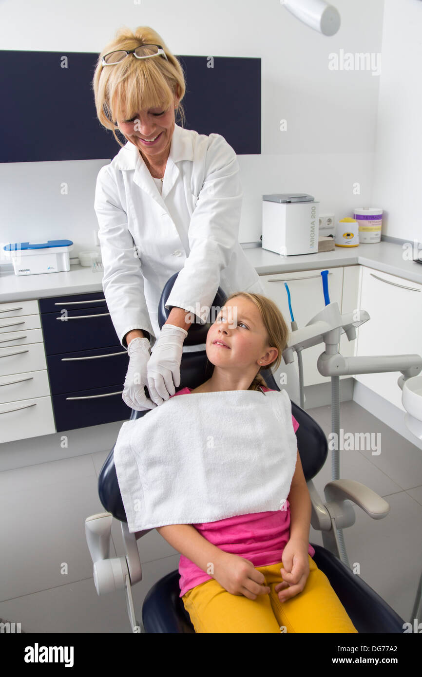 Dental practice, dentistry. Young girl at a dentist treatment Stock