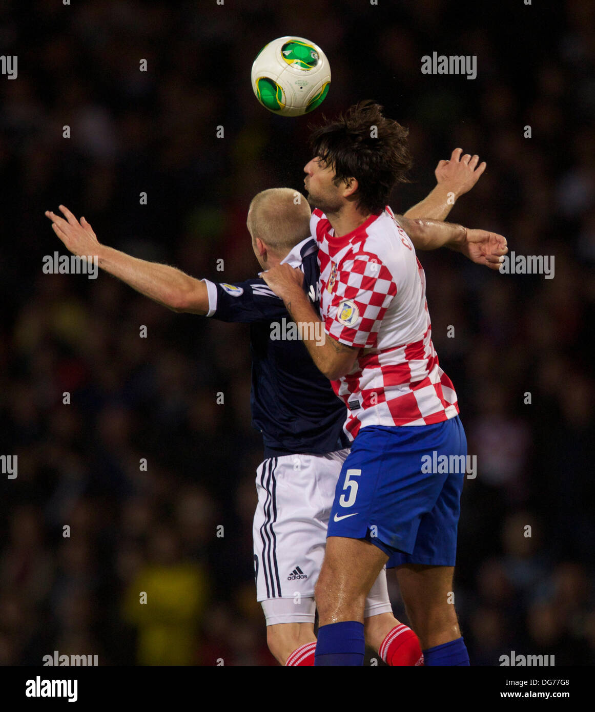 Glasgow, Scotland Steven Naismith of Scotland wins the heaer form Croatia's Vedran Corluka during the Fifa World Cup 2014 Group A Qualifer between Scotland and Croatia, from Hampden Park. 15th Oct, 2013. Credit:  Action Plus Sports/Alamy Live News Stock Photo