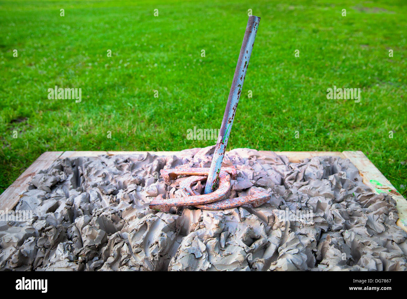 Clay horseshoe pitching pit for tournament with double ringer Stock