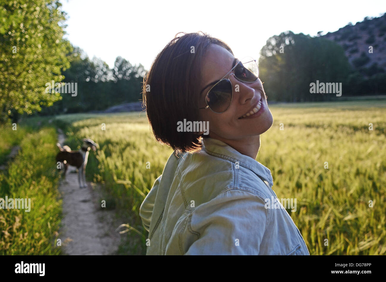 Young attractive woman takes a walk in nature Stock Photo - Alamy