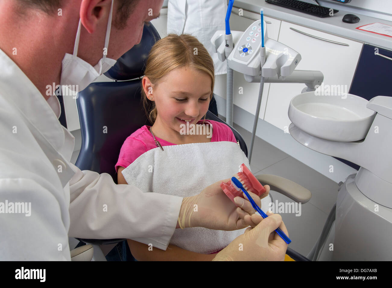 Dental practice, dentistry. Young girl at a dentist treatment Stock