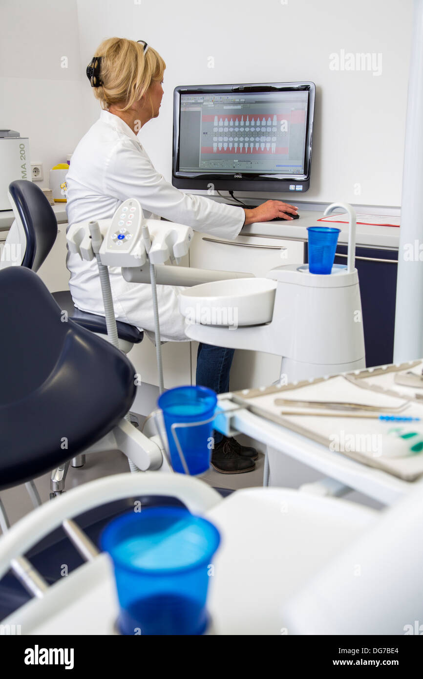 Dental practice, dentistry. Nurse transmits data of a patient in the