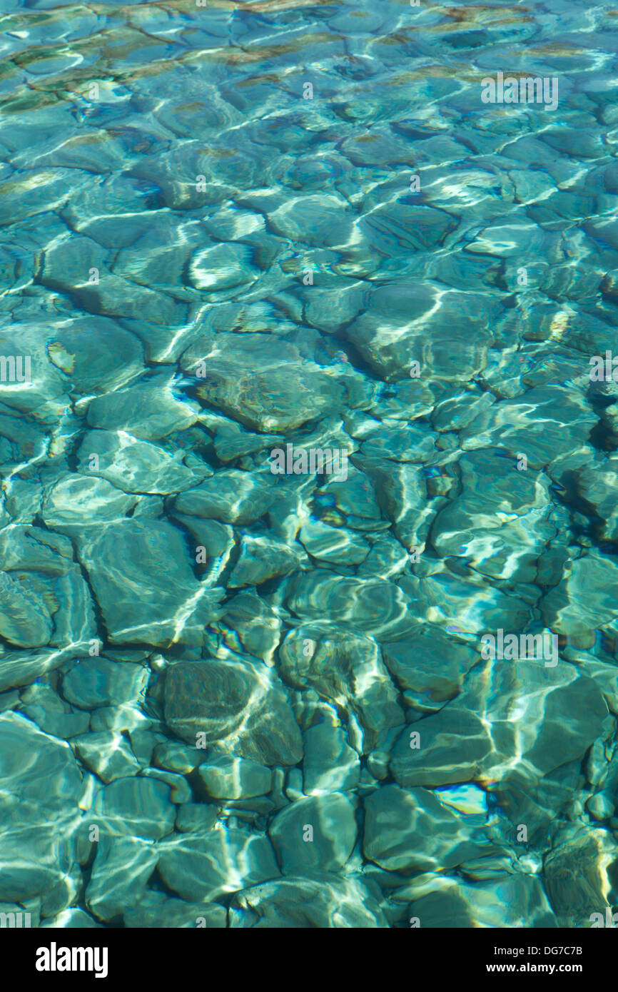 Turquoise sea water with ripples by Folengadros island in Greece, view from above Stock Photo