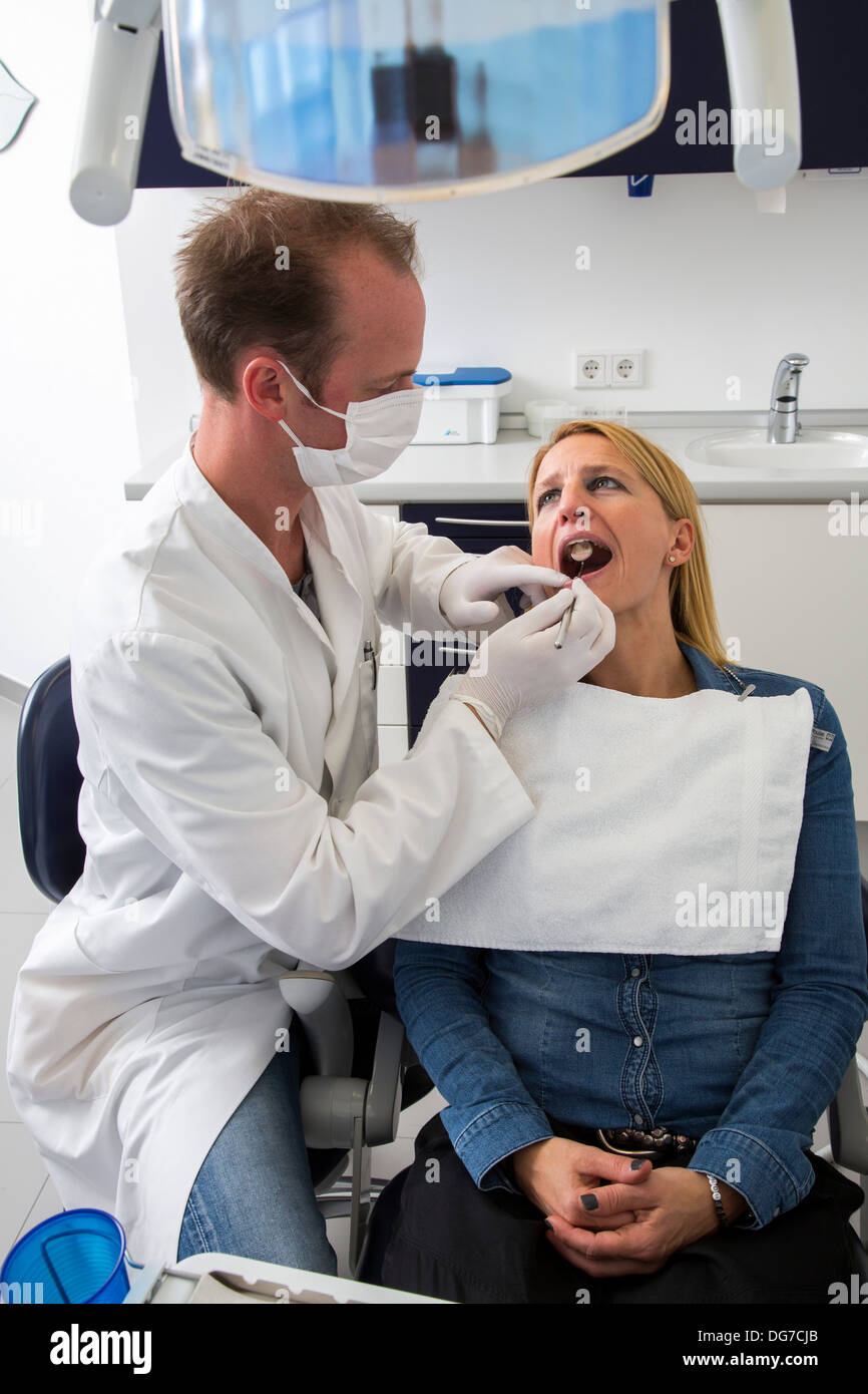 Dental practice, dentistry. Woman at a dentist treatment. Stock Photo