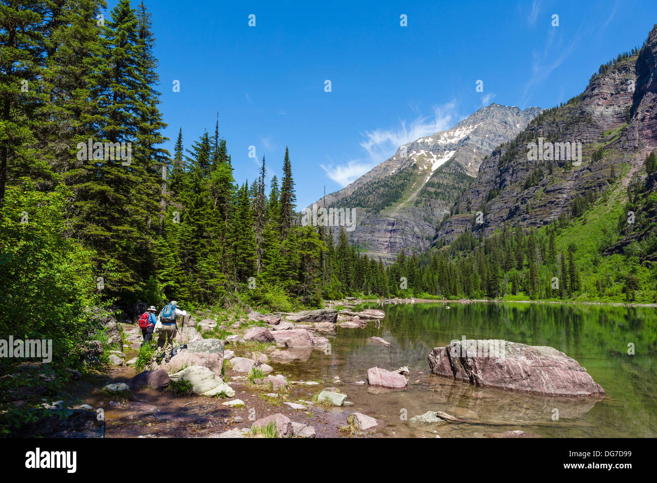 Hikers on the shore of Avalanche Lake, Glacier National Park, Montana, USA Stock Photo